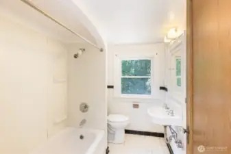 Beautifully classic tiled main bathroom.