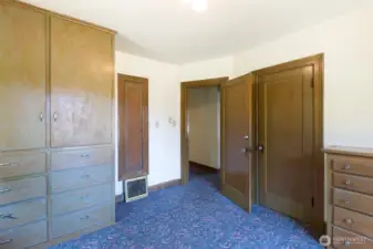 Built in armoire, ironing board and dresser! You don't find this often, beautifully preserved!