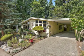 2 large storage sheds. 1 with power. 2 covered parking spaces. 1 additional uncovered