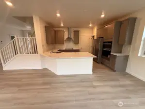 Upgraded Gourmet Kitchen Selections w/upgraded quartz backsplash and countertops