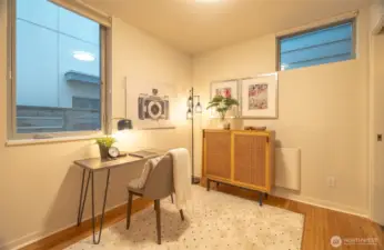 Lower level bedroom staged as an office.