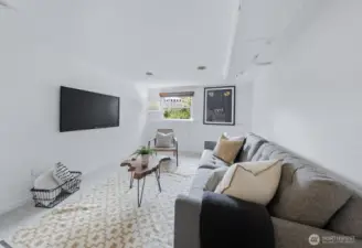 Fourth bedroom in the basement. This room has a closet, but is staged as a family room because it is quite large.