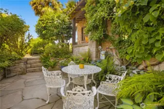 A side patio by the front door is a perfect spot to admire your garden.