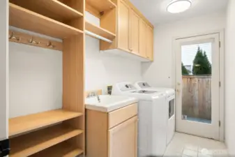 Laundry/mudroom with built-in cabinets on lower level