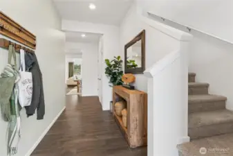 Large foyer perfect for a bench or coat rack. Actual home is under construction and finishes, materials, and colors will vary. See site agent for details.