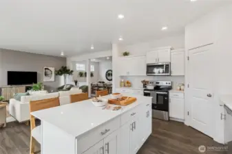 Very open concept lets the kitchen flow into the great room. Actual home is under construction and finishes, colors, and materials may vary. See site agent for details.