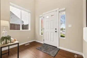 Expansive foyer designed to accommodate a coat rack and bench seating with ease!