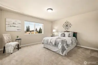 One of two spacious front bedrooms featuring beautiful views and generous closet space.