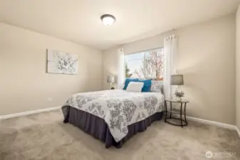 Two of two spacious front bedrooms featuring beautiful views and generous closet space.