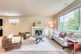 Step into an open concept great room seamlessly blending the living, dining and kitchen. A cozy gas fire place sits as the center piece in the living room, creating an ambiance of comfort and serenity.