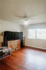 Wood floor main guest room