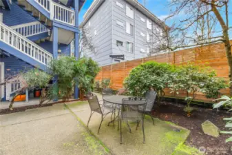 Well maintained courtyard with native evergreens and perennials.