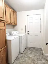 Utility area with closet