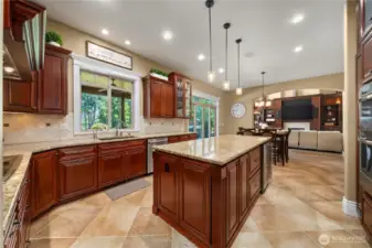 Kitchen w/slab granite, stainless appliances, eating area, walk-in pantry, tile flooring...
