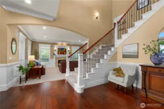 Stairs leading upstairs w/formal living in background.  Covered deck off entry & formal living.