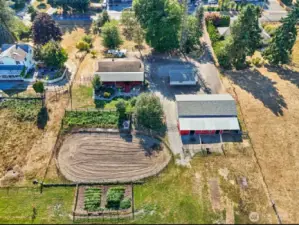 aerial view of arena, house, barn, garden and shops