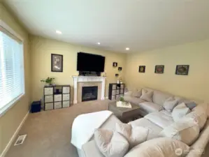 Family room with large window over looking backyard
