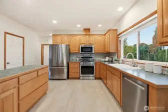 Kitchen w/ stainless steel appliances.