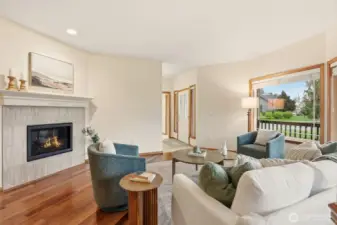 Dual sided fireplace brings warmth to front living room.