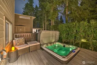 Backyard deck including hot tub
