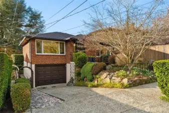 This adorable 1950s brick home offers a warm, easygoing lifestyle just 1/2 block from the trails, beaches, and open spaces of Discovery Park.