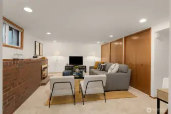 Downstairs, the daylight basement expands your living space with a large media room and gas fireplace, ideal for cozy movie nights or board game nights.