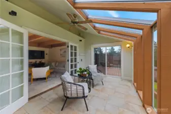 Inviting sunroom designed for relaxing in warmth and comfort while enjoying the natural wildlife that passes through the backyard each day.
