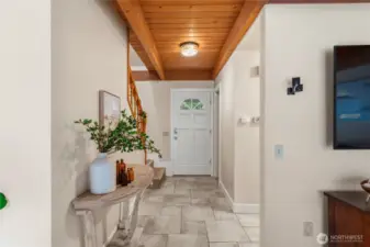 Welcoming front entry featuring warm wood ceiling details and an open, inviting foyer that sets the tone for the home.