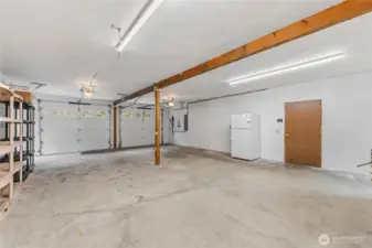 The garage is also equipped for electric vehicle charging, with a universal-compatible setup programmed by the owner for added convenience and future-ready living.