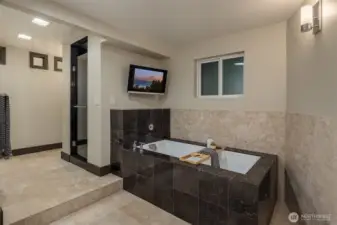 Large stone soaking tub designed for two.