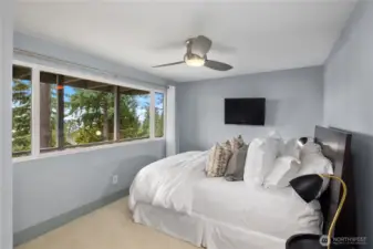 Second bedroom currently styled as a guest suite, showcasing truly magical views.