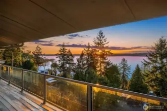 Glass railing on the water-facing side