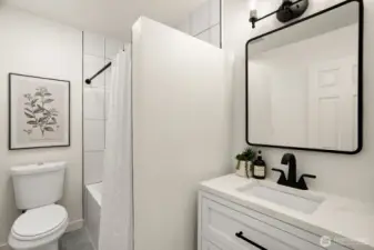 The main floor bath was just remodeled with new tile in the shower, a new tub, a new vanity and mirror with storage.