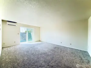 Primary bedroom with access to the enclosed patio and ensuite