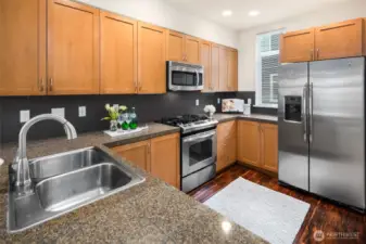 Granite Counters w/Full Heigh Backsplash.