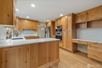 The generous kitchen space provides plenty of room for food preparation and storage.