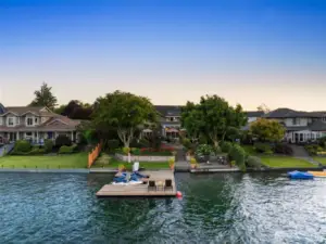 Rare 70ft of eastern facing waterfront. This oversized doc offers 2 jet ski lifts & room for boat parking. Spectacular Mt Rainier views w/swim area, bulkhead, firepit, many entertaining spaces & more!