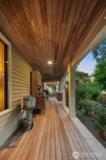 Wrap around porch with Brazilian walnut/ironwood. Cobblestone path leads from front flower filled gardens to Lake Tapps treasured shoreline.