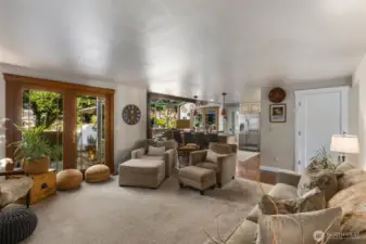 Open concept flow w/casual spaces, French doors open to wraparound porch w/stone pillars, gazebo, spa & private conversational areas.