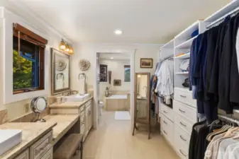 Large 5-piece bath w/custom built in vanity, tile floors, soaking tub, large walk in tile surround shower offering seamless customized design.