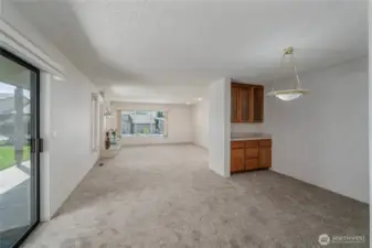 Dining area looking to Living room. To the left sliders to wrap around deck