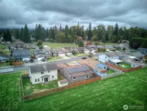 Aerial View of Home and Green Area Behind