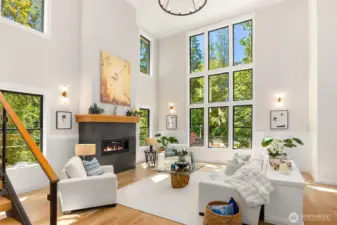 This home is filled with light and warmth thanks to soaring ceilings, recessed lighting, and abundant oversized windows throughout.