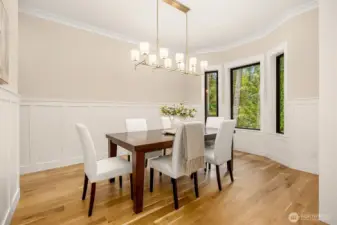 Dining room located off the entry foyer: Large bay window overlooks gorgeous front landscaping, Butler’s pantry with quartz counters and full wall of cabinetry, Wide plank white oak floors
