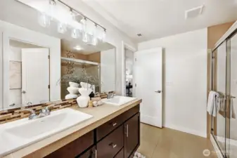 Primary bedroom ensuite bath with dual sinks