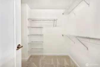 Primary bedroom walk-in closet