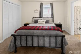 Primary bedroom with bathroom access and large closet.