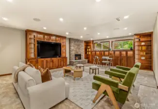 Lower level family room w/ custom,  lighted built ins.