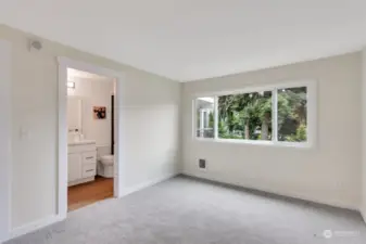 Primary bedroom also faces beautiful courtyard and has newly remodeled 3/4 bath and walk in closet.