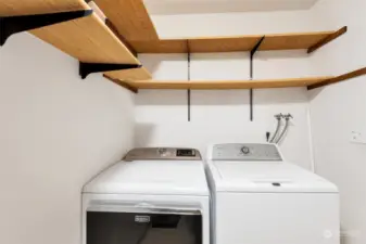 Large laundry room has tons of extra storage, plus two large closets in entry and hallway ensure plenty of room for storage.